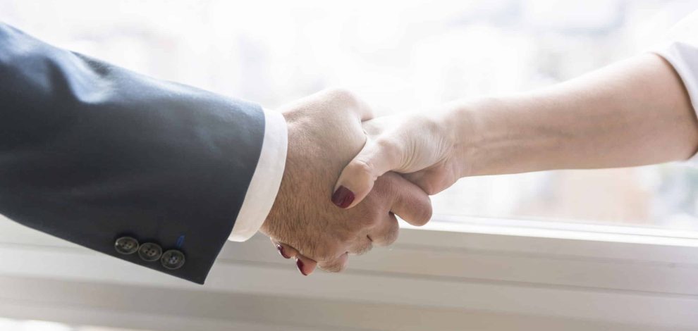 businesswoman-businessman-shaking-hands